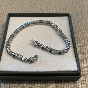 Silver and blue stone bracelet. CZ accents.
